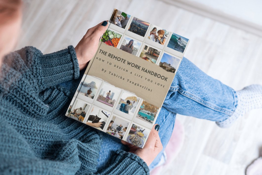 a-woman-holding-a-copy-of-the-remote-work-handbook-how-to-design-a-life-you-love